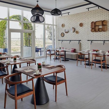 Movenpick Jumeirah Village Triangle ドバイ エクステリア 写真 Restaurant