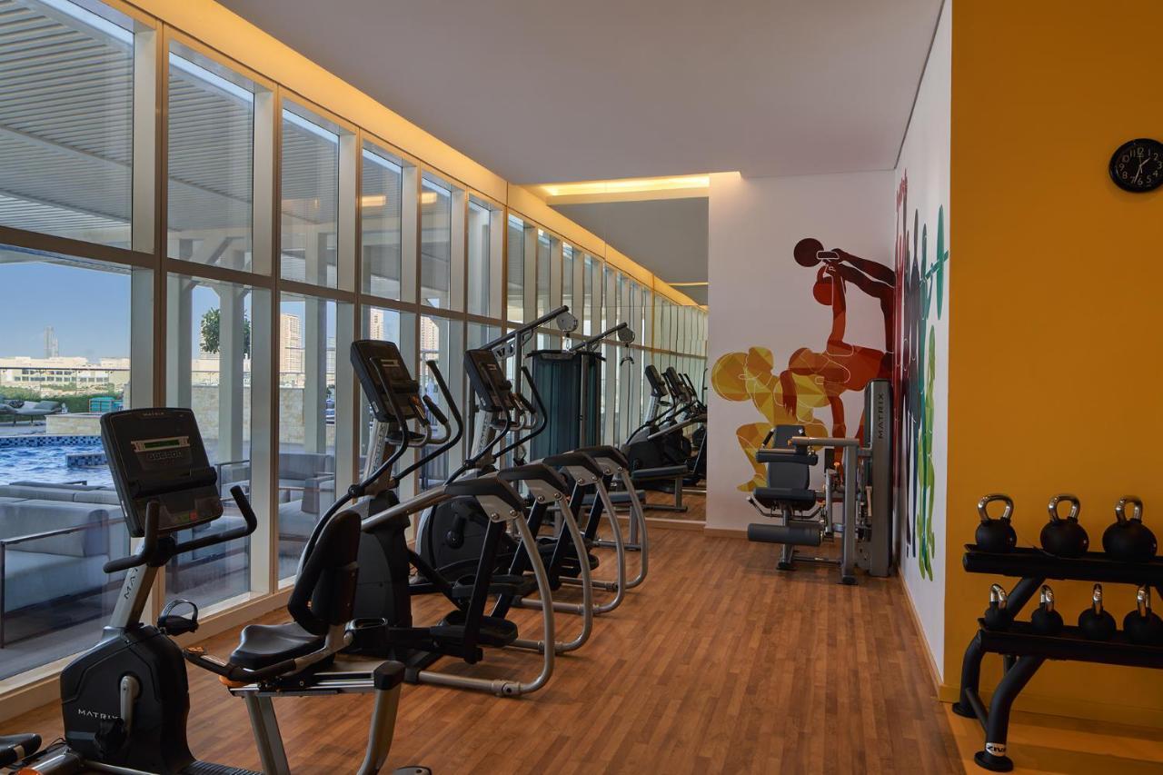Movenpick Jumeirah Village Triangle ドバイ エクステリア 写真 The gym at the hotel