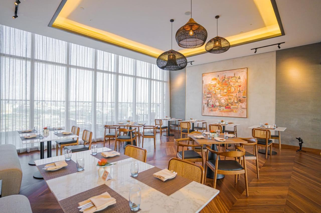 Movenpick Jumeirah Village Triangle ドバイ エクステリア 写真 The restaurant