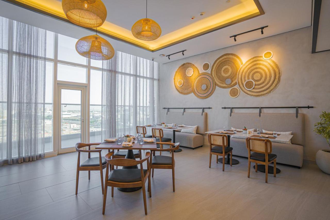 Movenpick Jumeirah Village Triangle ドバイ エクステリア 写真 The restaurant