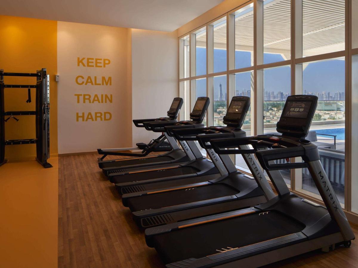 Movenpick Jumeirah Village Triangle ドバイ エクステリア 写真 The gym at the hotel